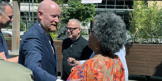 Candidate Aaron Marshall greeting voters