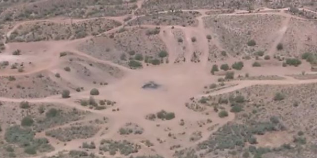 remote desert area with remains of bonfire