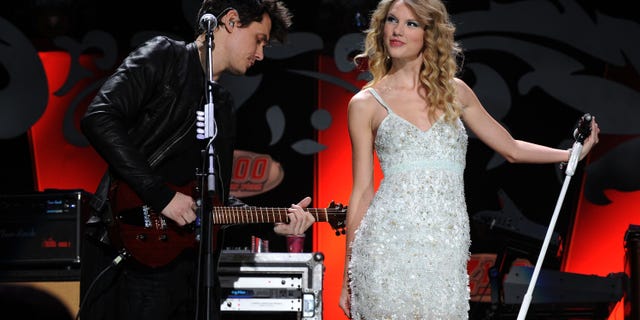 John Mayer and Taylor Swift performing onstage