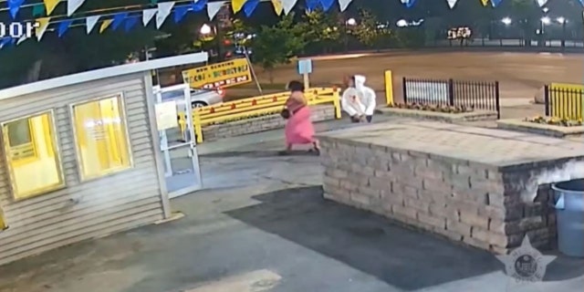 Hood and son outside restuarant