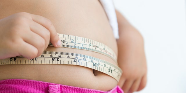 Child measuring stomach