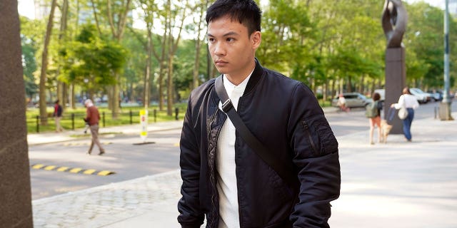 Zheng Congying outside as he leaves a courthouse