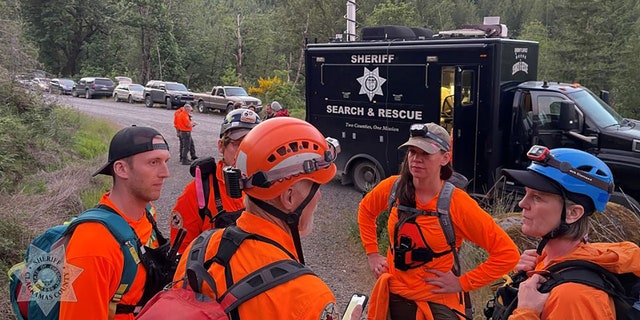 search team gathered on road