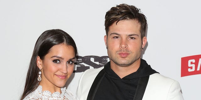 Cody Longo and Stephanie Longo walk red carpet at pre-Grammys party