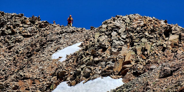 searchers in mountains
