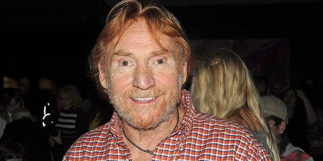 Danny Bonaduce wears plaid shirt with a necklace at event