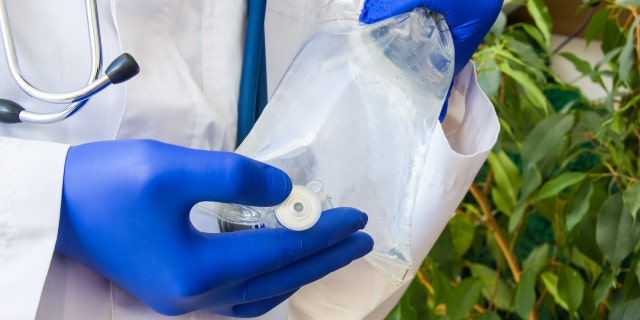 Doctor with IV bag