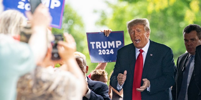 Former President Donald Trump campaigns in Iowa