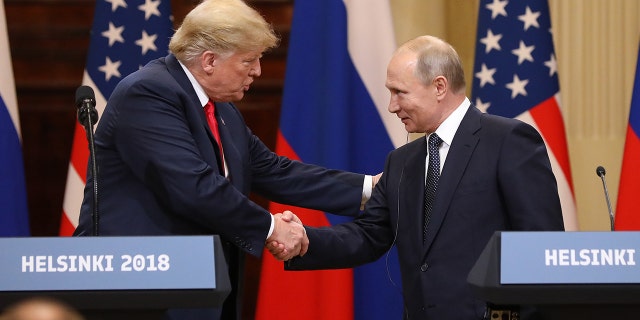 President Trump shakes hand with Russian President Vladimir Putin during a news conference in Helsinki, Finland