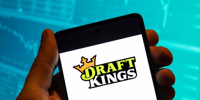 The DraftKings logo on a phone