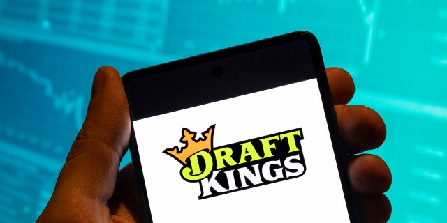 The DraftKings logo on a phone