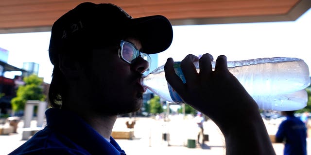 man drinks water