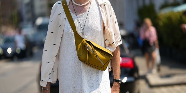 A fanny pack being worn as a cross body bag