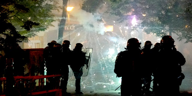 Fireworks are shot at French police during a riot in Nanterre, outside of Paris