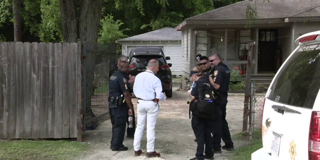 Officials standing around