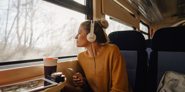 young woman traveling on train