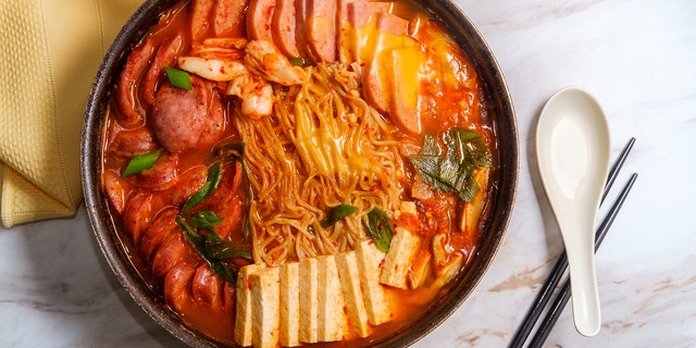 a bowl of Budae-jjigae, a Korean dish that features SPAM