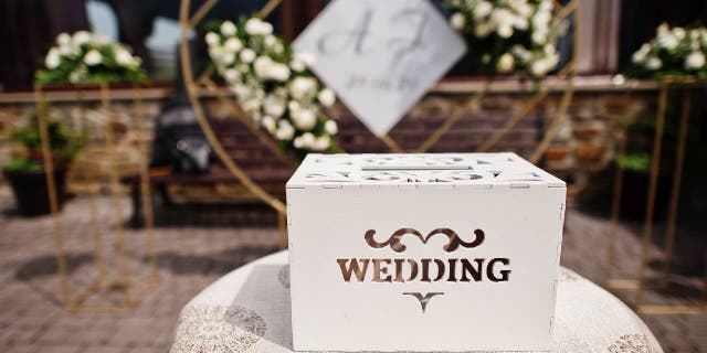 Wedding card box on gift table.