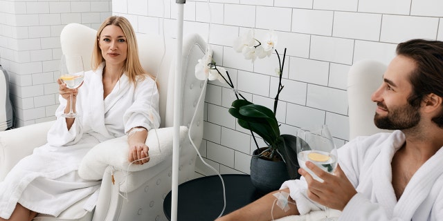 couple recieves IV drip treatment