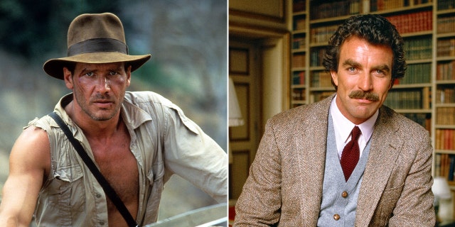 Harrison Ford as Indiana Jones in a unbuttoned shirt and hat split Tom Selleck as Tom Magnum in "Magnum P.I." sitting on a desk