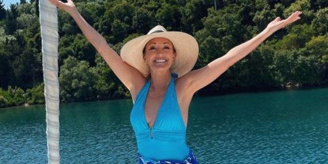 Jane Seymour in a blue swimsuit in Greece