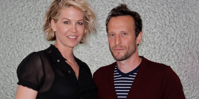 Jenna Elfman sports sheer black top next to husband and Bodhi Elfman