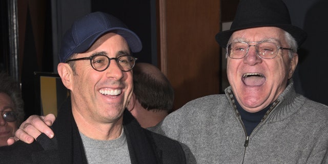 Jerry Seinfeld and Pat Cooper share a laugh outside of Caroline's comedy club