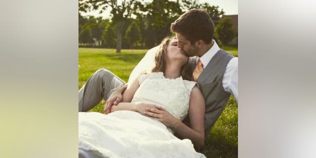 jill and derick kissing at their wedding