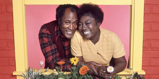 John Amos and Florida Evans perch on a yellow window sill for Good Times promotion