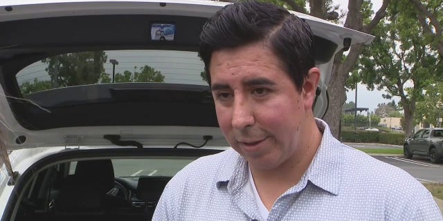 John Reyes speaks to a news crew.