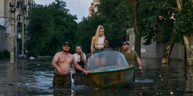 women evacuated by boat