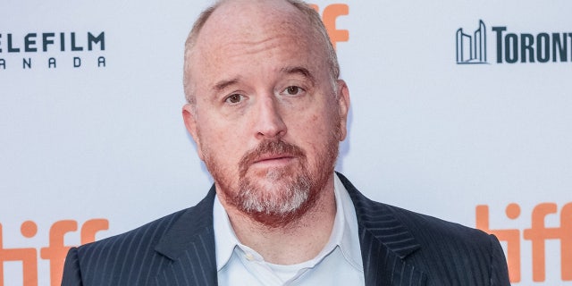 Louis C.K. wears striped suit on red carpet