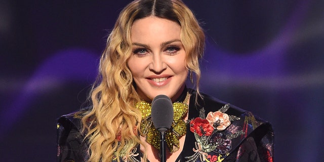 Madonna wears colorful suit on stage