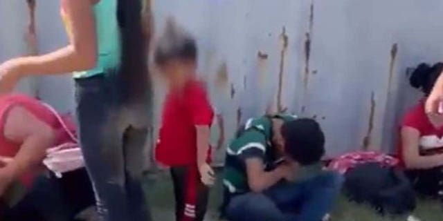 Migrant children recovering in the shade