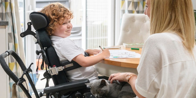 Muscular dystrophy boy with mom