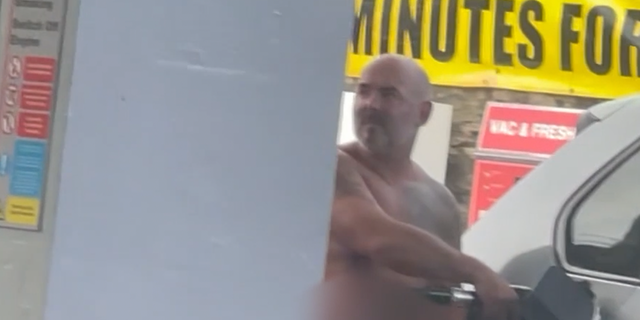 Naked man pumps gas
