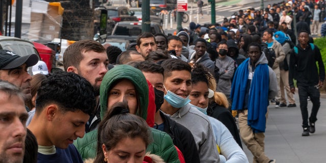 Asylum-seekers outside Javits building