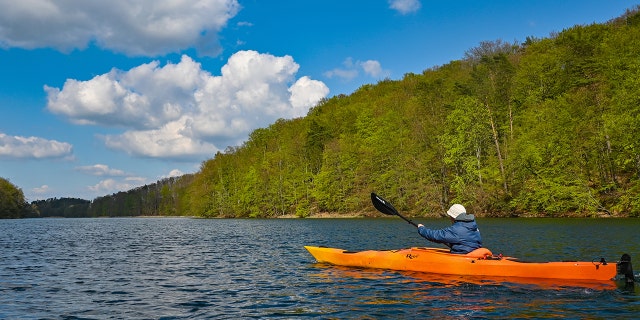 An orange kayak in the water