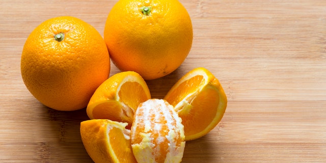 Oranges on a cutting board