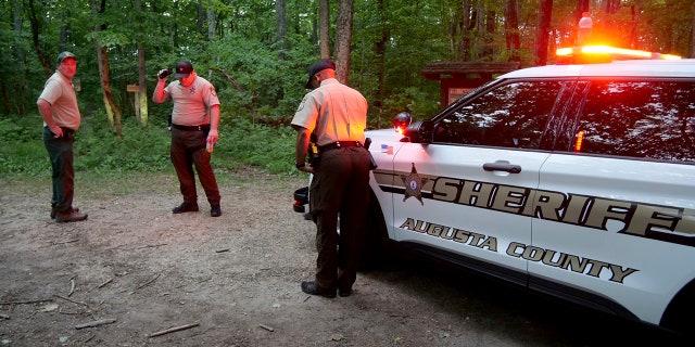 authorities at entrance to trail