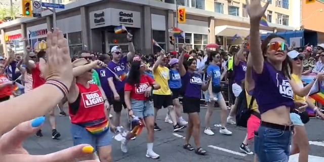 Pride Toronto attendees wearing Bud Light