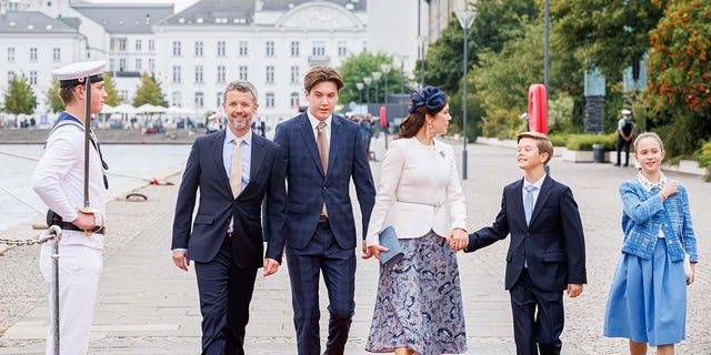 Prince Christian walking with his family