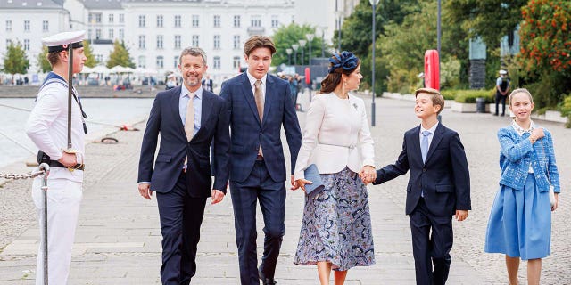 Prince Christian walking with his family