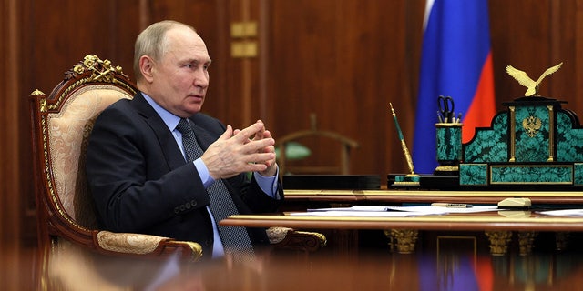 Putin at desk