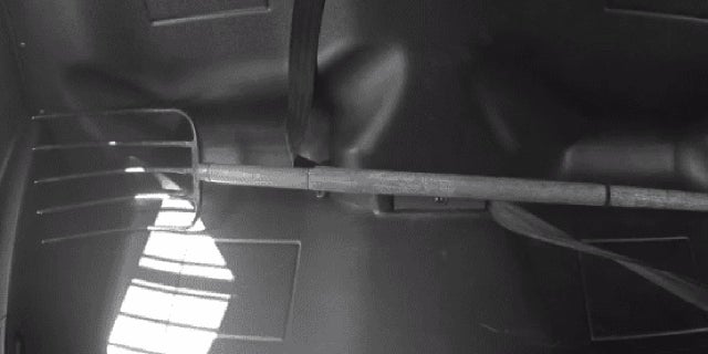 pitchfork in back of police car