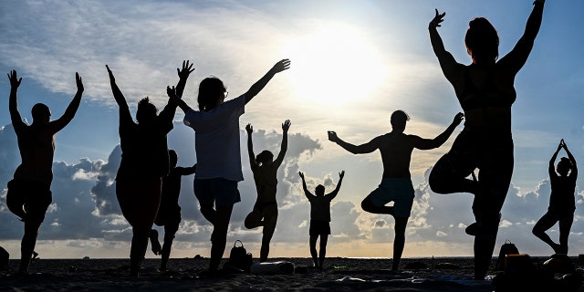 People do yoga outside