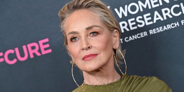 sharon stone looking serious on red carpet