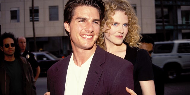 Nicole Kidman hugs husband Tom Cruise from behind