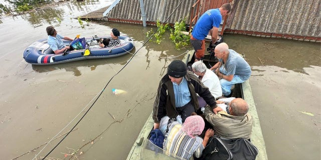 a photo of Kherson residents in boats