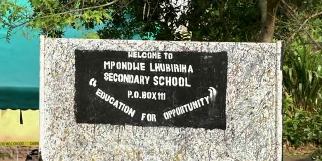 A sign of the Lhubiriha Secondary School in Mpondwe, Uganda